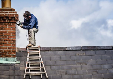 Pointing and brickwork repairs to chimney stack